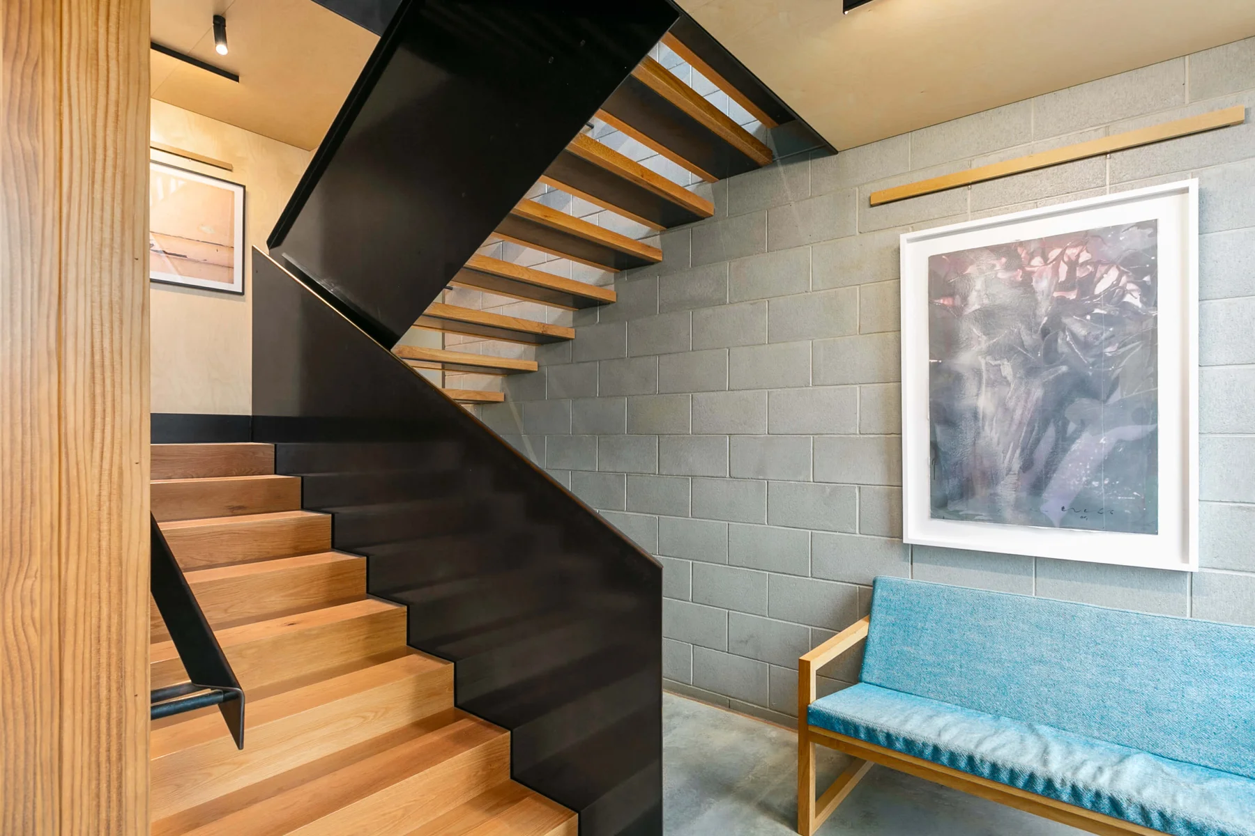 A carefully resolved timber and steel staircase