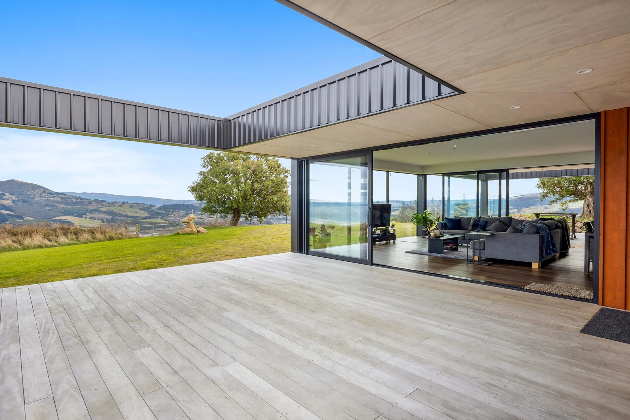 A completed architectural home with sheltered decking and sweeping views over the Otago hills