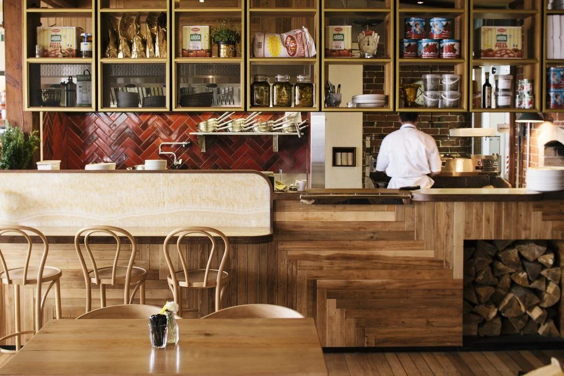 Timber counter and shelving in the restaurant bar