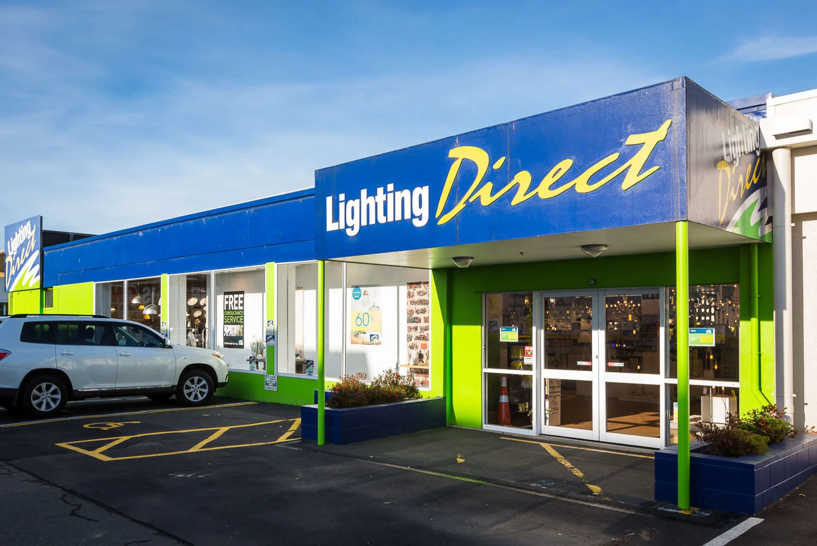 Lighting Direct storefront with blue signage and glazed entrance